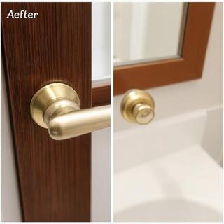 After: brushed brass lever on painted door